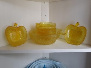 Set of translucent yellow apple-shaped bowls.