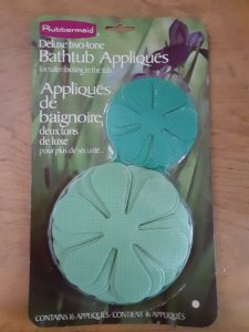 Image showing vintage Rubbermaid brand bathtub decals in green daisy shapes.